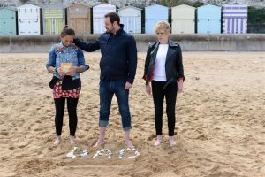 Eastenders Carter Family in Broadstairs - on the beach with beach huts and pepple memorial to "Dad"