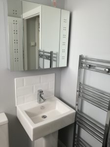 family bathroom chrome fittings and white suite 